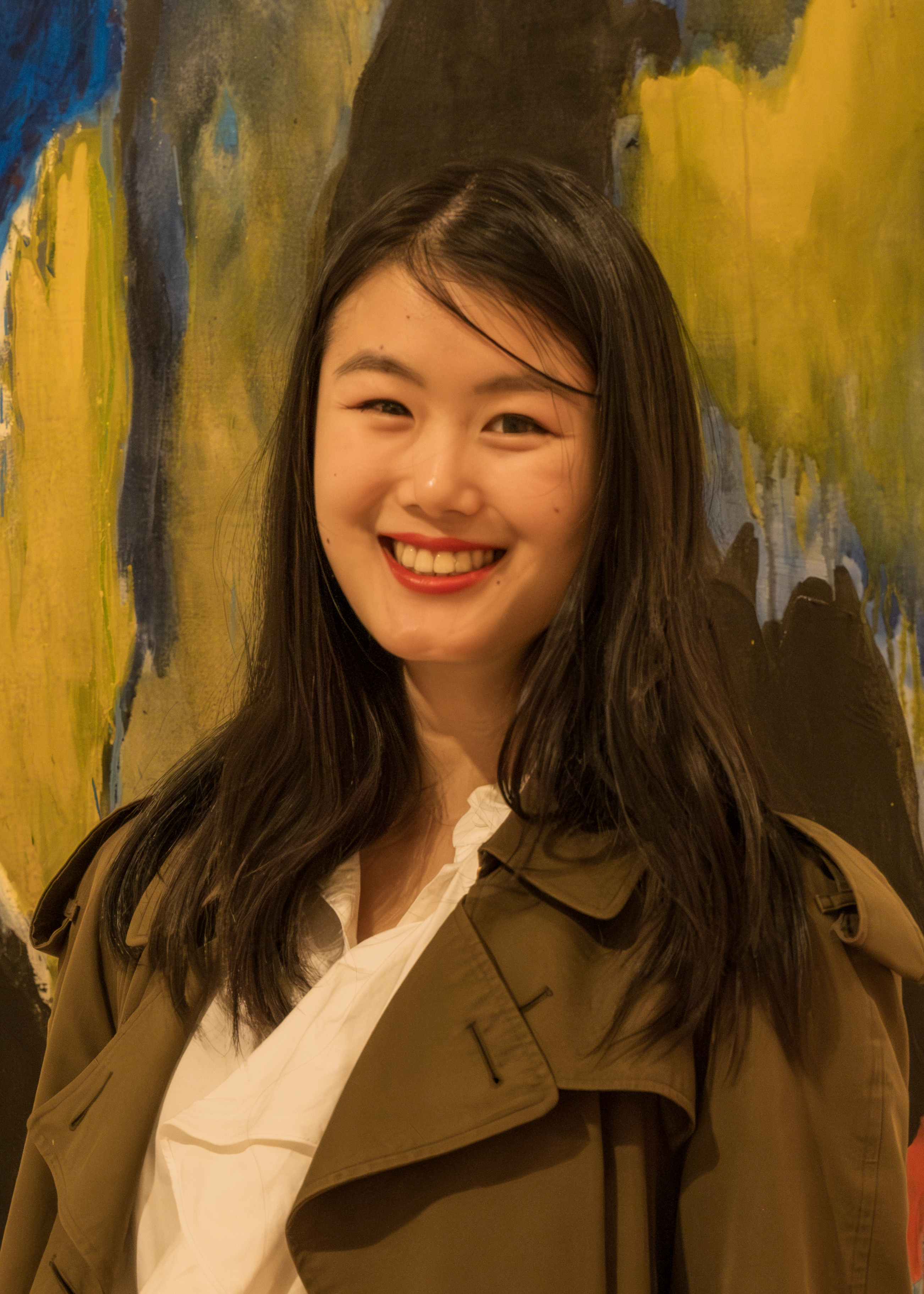 person standing in front of art piece